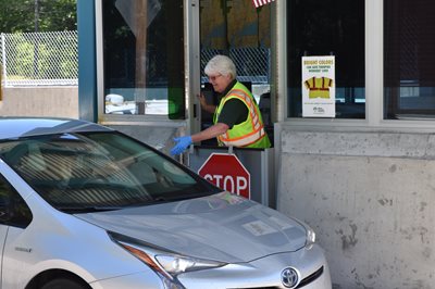 Toll worker taking money at Exit 52 Toll